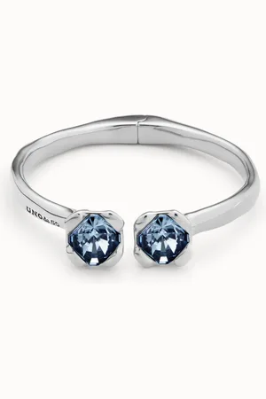 UNO de 50 Pulsera rígida bañada en plata de ley, con muelle interior y dos cristales azules