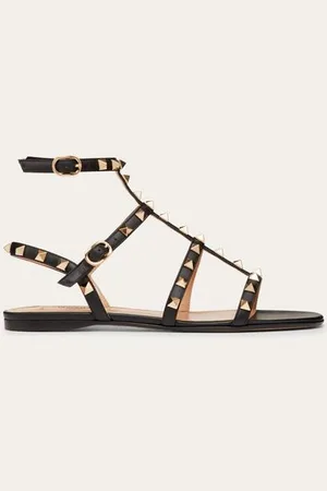 VALENTINO GARAVANI SANDALIAS PLANAS ROCKSTUD DE PIEL DE BECERRO CON TIRAS Mujer 34.5