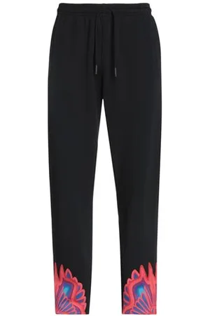 MARCELO BURLON PARTES DE ABAJO - Pantalones