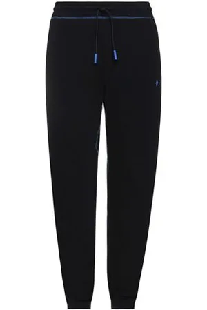 MARCELO BURLON PARTES DE ABAJO - Pantalones