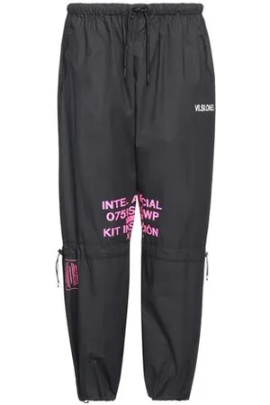 MARCELO BURLON PARTES DE ABAJO - Pantalones