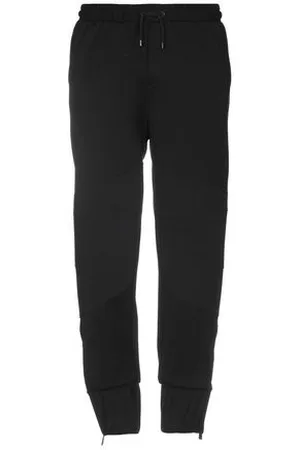 MARCELO BURLON PARTES DE ABAJO - Pantalones