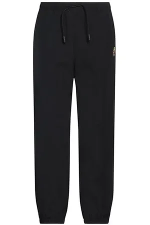 MARCELO BURLON PARTES DE ABAJO - Pantalones