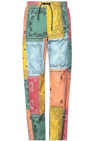 MARCELO BURLON PARTES DE ABAJO - Pantalones