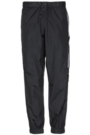 MARCELO BURLON PARTES DE ABAJO - Pantalones