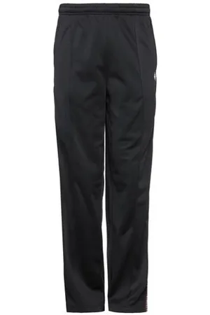 MARCELO BURLON PARTES DE ABAJO - Pantalones
