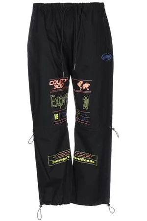 MARCELO BURLON PARTES DE ABAJO - Pantalones