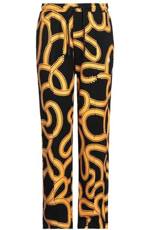 MARCELO BURLON PARTES DE ABAJO - Pantalones