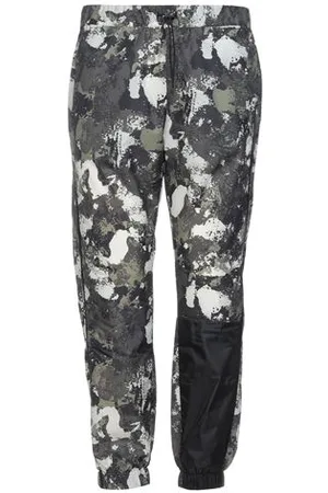 MARCELO BURLON PARTES DE ABAJO - Pantalones