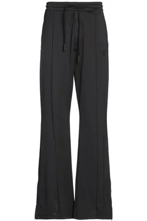 MARCELO BURLON PARTES DE ABAJO - Pantalones