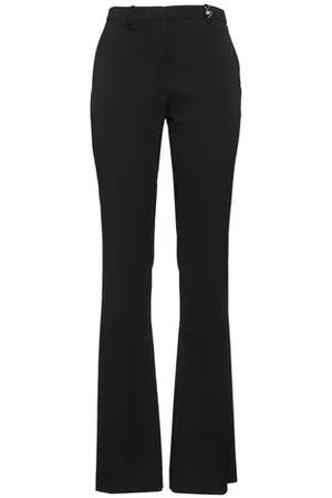 VERSACE PARTES DE ABAJO - Pantalones