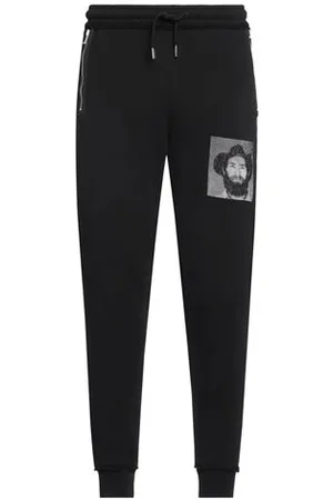 MARCELO BURLON PARTES DE ABAJO - Pantalones
