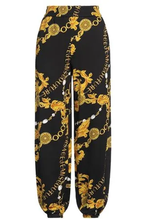 VERSACE PARTES DE ABAJO - Pantalones