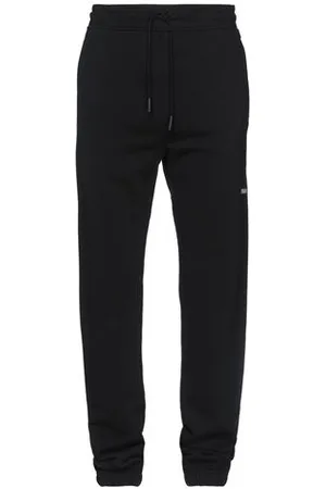 MARCELO BURLON PARTES DE ABAJO - Pantalones