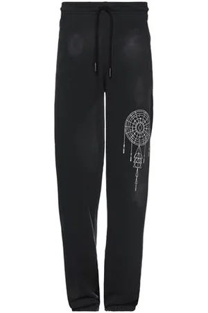 MARCELO BURLON PARTES DE ABAJO - Pantalones