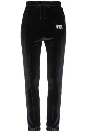 MARCELO BURLON PARTES DE ABAJO - Pantalones