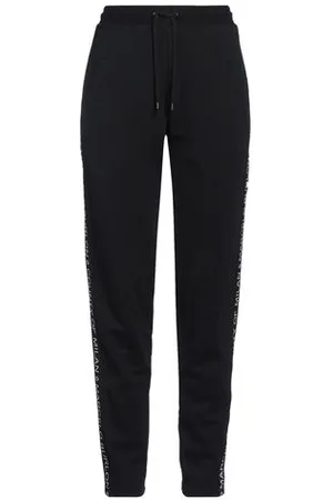 MARCELO BURLON PARTES DE ABAJO - Pantalones