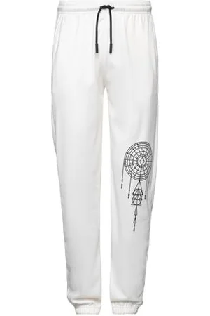 MARCELO BURLON PARTES DE ABAJO - Pantalones