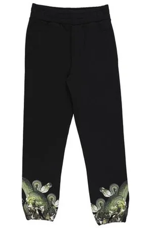 MARCELO BURLON PARTES DE ABAJO - Pantalones