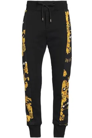 VERSACE PARTES DE ABAJO - Pantalones