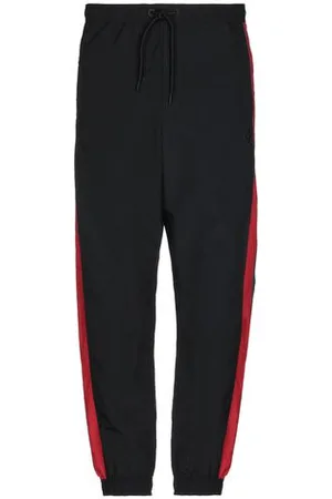 MARCELO BURLON PARTES DE ABAJO - Pantalones