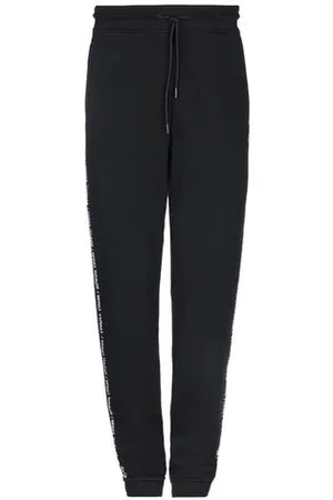MARCELO BURLON PARTES DE ABAJO - Pantalones