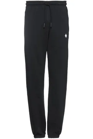 MARCELO BURLON PARTES DE ABAJO - Pantalones