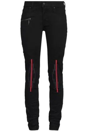 MARCELO BURLON PARTES DE ABAJO - Pantalones vaqueros
