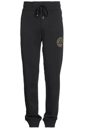 VERSACE PARTES DE ABAJO - Pantalones