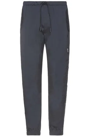 MARCELO BURLON PARTES DE ABAJO - Pantalones