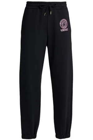 VERSACE PARTES DE ABAJO - Pantalones
