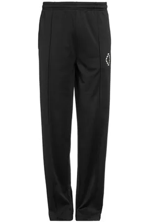 MARCELO BURLON PARTES DE ABAJO - Pantalones