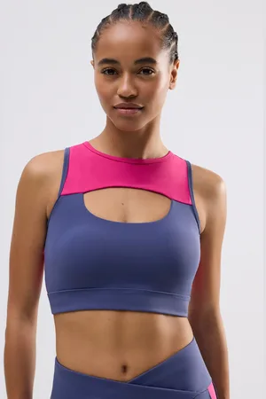 YSABEL MORA Sujetador deportivo con detalles cut out sujeción media color block